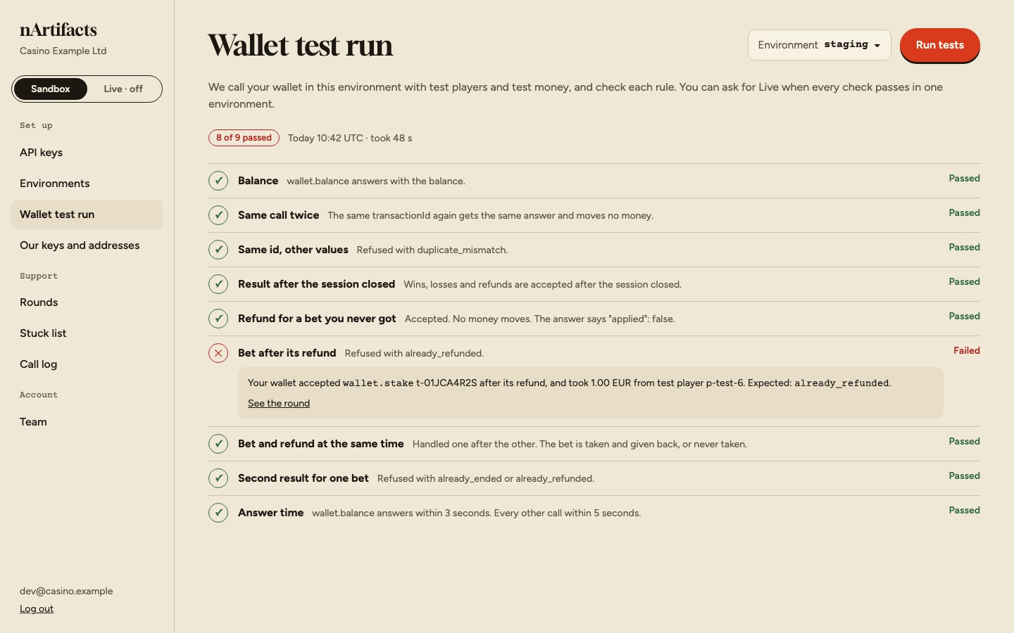 The wallet test run screen: eight of nine checks passed, one failed with what was expected.